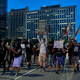 Protesters march down the streets during a rally in remembrance of Sandra Bland on July 13, 2020, in Dallas, Texas. e caption